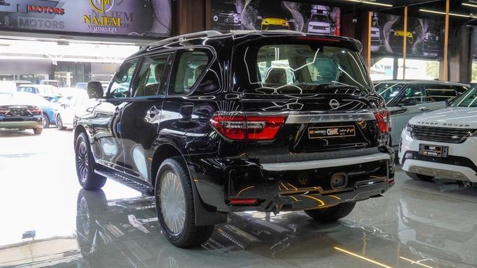 New Nissan Patrol VI (Y62) Facelift 2, 5.6 l, 2024 in Dubai by Najem Motors, Black color. GCC Specs | AUTO.AE
