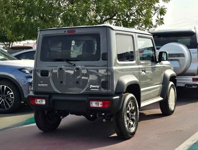New Suzuki Jimny IV, 1.5 l, 2024 in Dubai by SK Motors, Grey color. GCC Specs | AUTO.AE