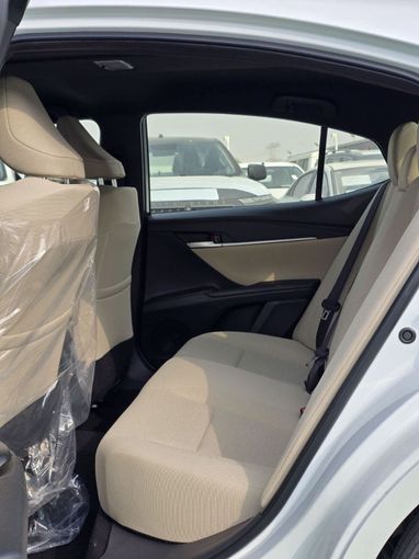 New Toyota Camry IX (XV80), 2.5 l, 2025 in Dubai by Mohamed Hakim Motors, White color. GCC Specs | AUTO.AE