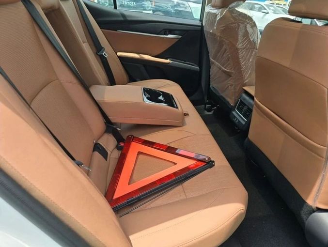 New Toyota Camry IX (XV80) China Market, 2.0 l, 2024 in Dubai by Mohamed Hakim Motors, White color. Chinese Specs | AUTO.AE