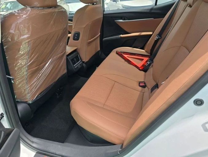 New Toyota Camry IX (XV80) China Market, 2.0 l, 2024 in Dubai by Mohamed Hakim Motors, White color. Chinese Specs | AUTO.AE