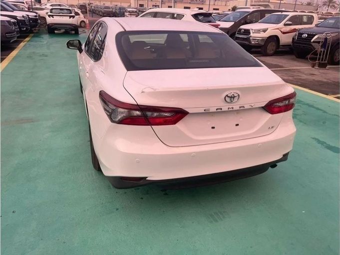 New Toyota Camry IX (XV80), 2.5 l, 2024 in Dubai by Mohamed Hakim Motors, White color. GCC Specs | AUTO.AE