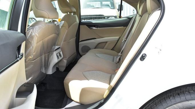 New Toyota Camry IX (XV80), 2.5 l, 2024 in Dubai by Najem Motors, White color. GCC Specs | AUTO.AE