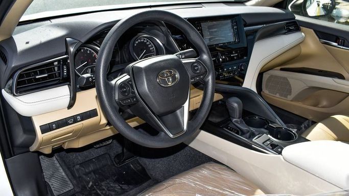 New Toyota Camry IX (XV80), 2.5 l, 2024 in Dubai by Najem Motors, White color. GCC Specs | AUTO.AE