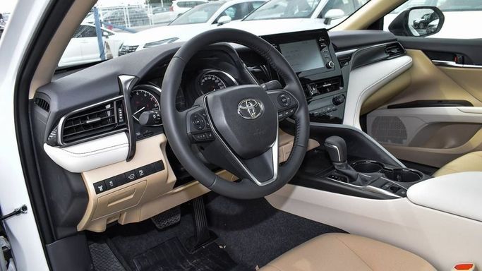 New Toyota Camry IX (XV80), 2.5 l, 2024 in Dubai by Najem Motors, White color. GCC Specs | AUTO.AE