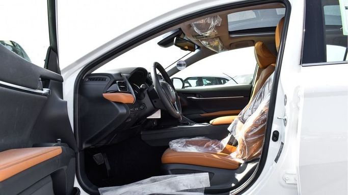 New Toyota Camry IX (XV80), 2.5 l, 2024 in Dubai by Najem Motors, White color. GCC Specs | AUTO.AE