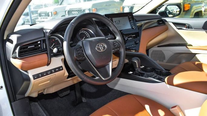 New Toyota Camry VIII (XV70) Facelift, 2.5 l, 2023 in Dubai by Najem Motors, White color. GCC Specs | AUTO.AE