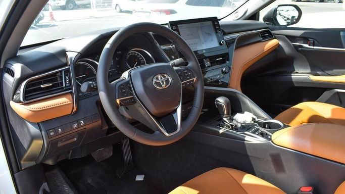 New Toyota Camry IX (XV80), 2.5 l, 2024 in Dubai by Najem Motors, White color. GCC Specs | AUTO.AE