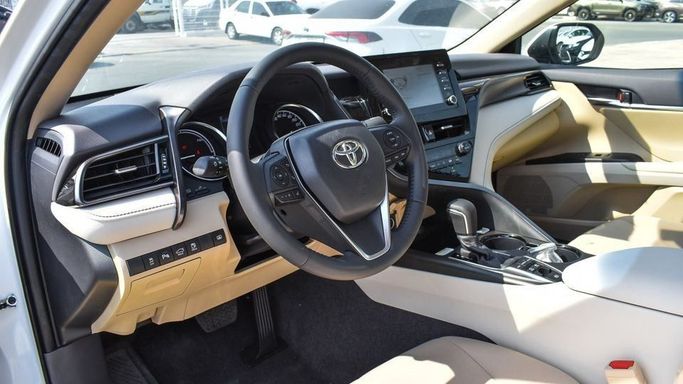 New Toyota Camry IX (XV80), 2.5 l, 2024 in Dubai by Najem Motors, White color. GCC Specs | AUTO.AE