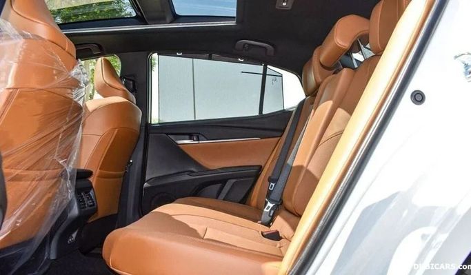 New Toyota Camry IX (XV80), 2.5 l, 2024 in Dubai by Najem Motors, White color. GCC Specs | AUTO.AE