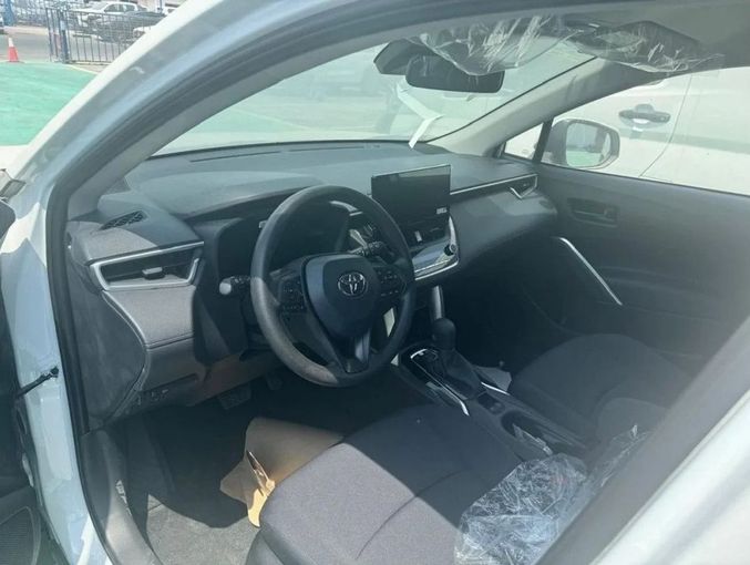 New Toyota Corolla Cross I, 2.0 l, 2025 in Dubai by Mohamed Hakim Motors, White color. Chinese Specs | AUTO.AE