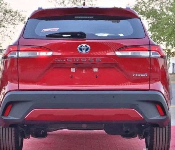 New Toyota Corolla Cross I, 1.8 l, 2024 in Dubai by Mohamed Hakim Motors, Red color. GCC Specs | AUTO.AE