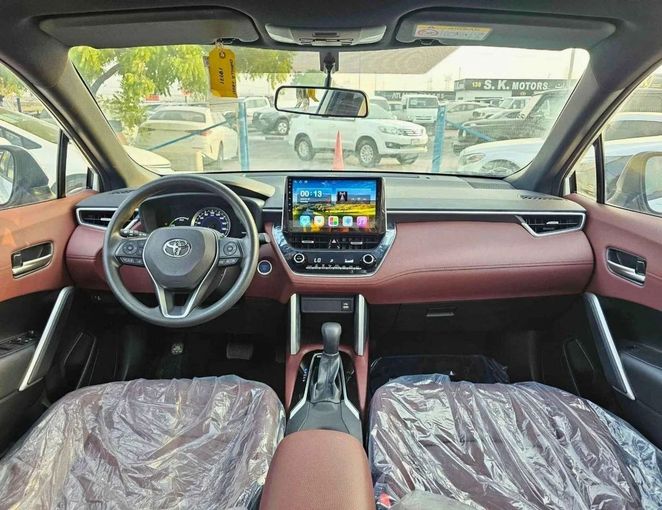 Новый Toyota Corolla Cross I, 1.8 л, 2024 в Дубае от SK Motors Белый цвет. GCC | AUTO.AE