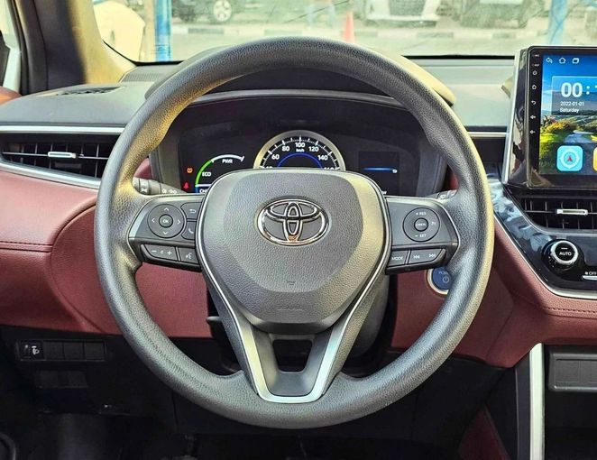New Toyota Corolla Cross I, 1.8 l, 2024 in Dubai by SK Motors, White color. GCC Specs | AUTO.AE