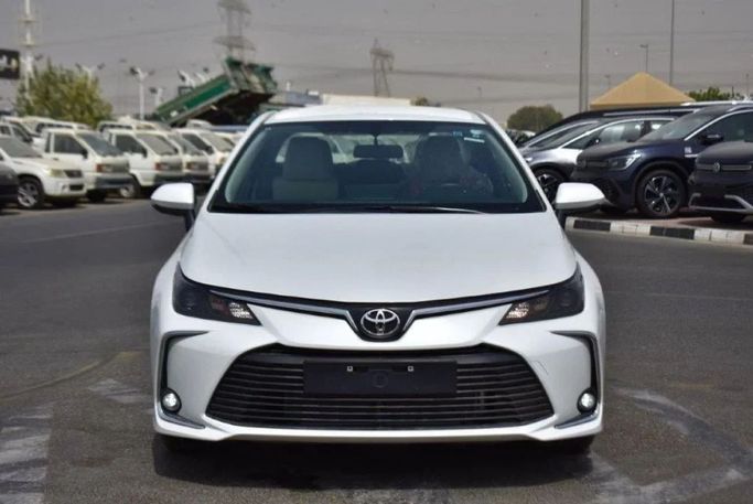 New Toyota Corolla Sporty XII (E210), 2.0 l, 2023 in Dubai by Mohamed Hakim Motors, White color. GCC Specs | AUTO.AE