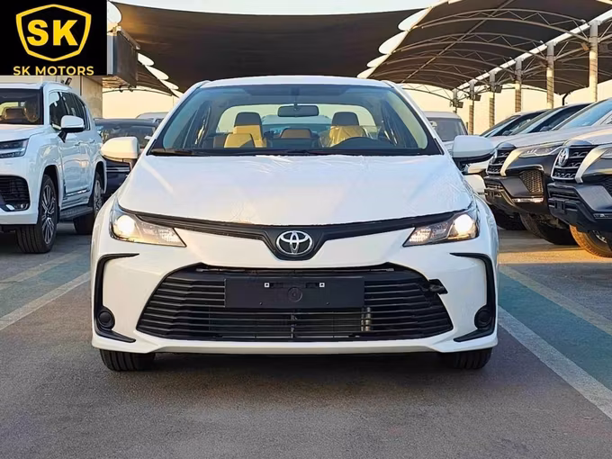 New Toyota Corolla XII (E210), 1.6 l, 2025 in Dubai by SK Motors, White color. GCC Specs | AUTO.AE