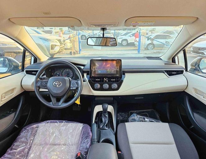 New Toyota Corolla XII (E210), 1.6 l, 2025 in Dubai by SK Motors, White color. GCC Specs | AUTO.AE
