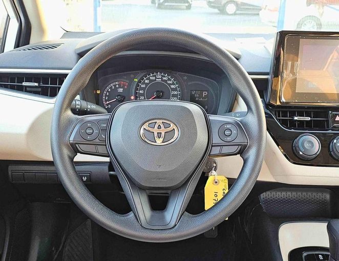 New Toyota Corolla XII (E210), 1.6 l, 2025 in Dubai by SK Motors, White color. GCC Specs | AUTO.AE