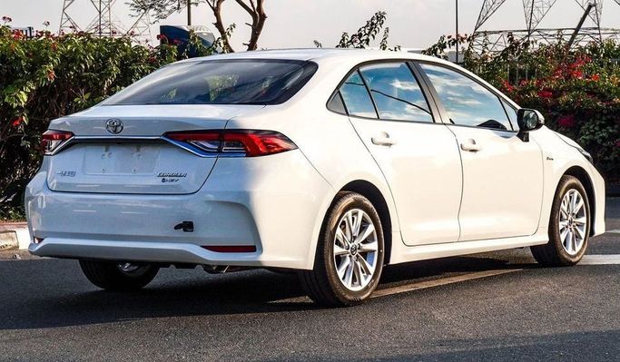 New Toyota Corolla Sporty XII (E210) Facelift, 1.8 l, 2024 in Dubai by Najem Motors, White color. Chinese Specs | AUTO.AE