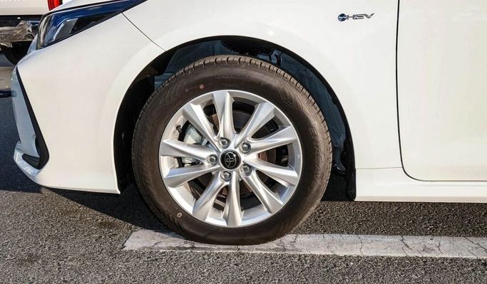 New Toyota Corolla Sporty XII (E210) Facelift, 1.8 l, 2024 in Dubai by Najem Motors, White color. Chinese Specs | AUTO.AE