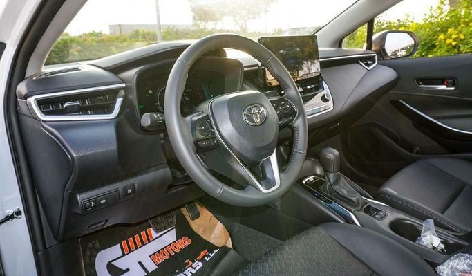 New Toyota Corolla Sporty XII (E210) Facelift, 1.8 l, 2024 in Dubai by Najem Motors, White color. Chinese Specs | AUTO.AE