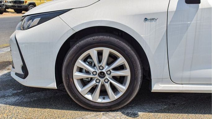 New Toyota Corolla Sporty XII (E210) Facelift, 1.8 l, 2024 in Dubai by Najem Motors, White color. Chinese Specs | AUTO.AE