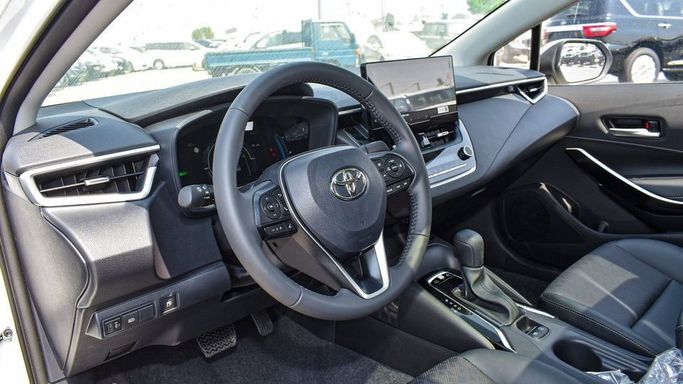 New Toyota Corolla Sporty XII (E210) Facelift, 1.8 l, 2024 in Dubai by Najem Motors, White color. Chinese Specs | AUTO.AE