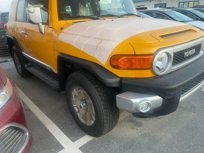 New Toyota FJ Cruiser, 4.0 l, 2023 in Dubai by Mohamed Hakim Motors, Yellow color. GCC Specs | AUTO.AE