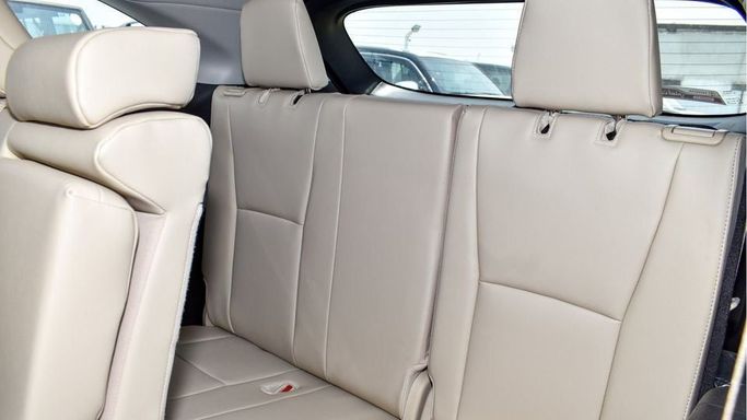 New Toyota Highlander IV (U70), 2.5 l, 2024 in Dubai by Najem Motors, White color. GCC Specs | AUTO.AE