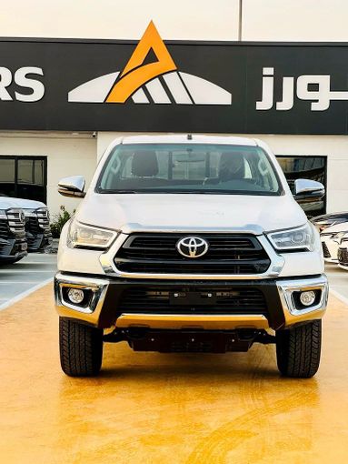 New Toyota Hilux VIII Facelift, 2.7 l, 2025 in Dubai by ANDIAMO MOTORS FZE, White color. GCC Specs | AUTO.AE