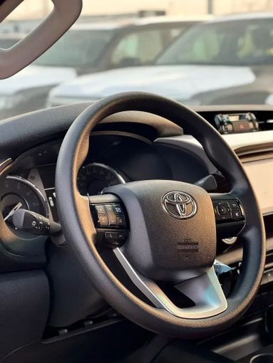 New Toyota Hilux VIII Facelift, 2.7 l, 2025 in Dubai by ANDIAMO MOTORS FZE, White color. GCC Specs | AUTO.AE