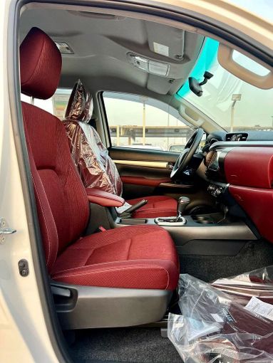 New Toyota Hilux VIII Facelift, 2.7 l, 2025 in Dubai by ANDIAMO MOTORS FZE, White color. GCC Specs | AUTO.AE