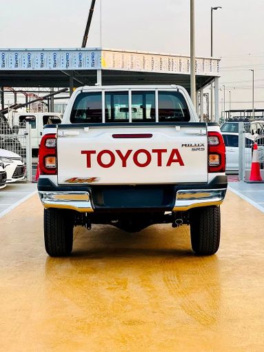 New Toyota Hilux VIII Facelift, 2.7 l, 2025 in Dubai by ANDIAMO MOTORS FZE, White color. GCC Specs | AUTO.AE