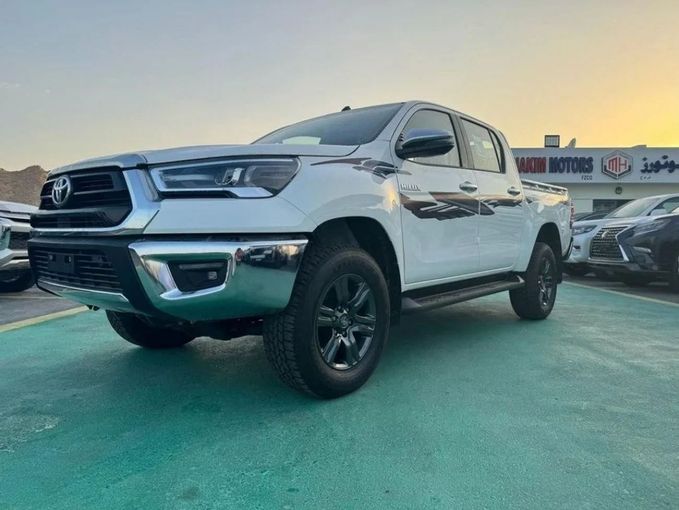 New Toyota Hilux VIII Facelift, 2.4 l, 2025 in Dubai by Mohamed Hakim Motors, White color. GCC Specs | AUTO.AE