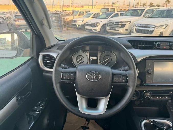 New Toyota Hilux VIII Facelift, 2.4 l, 2025 in Dubai by Mohamed Hakim Motors, White color. GCC Specs | AUTO.AE