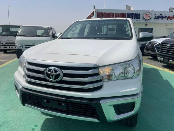 New Toyota Hilux VIII Facelift, 2.7 l, 2023 in Dubai by Mohamed Hakim Motors, White color. GCC Specs | AUTO.AE