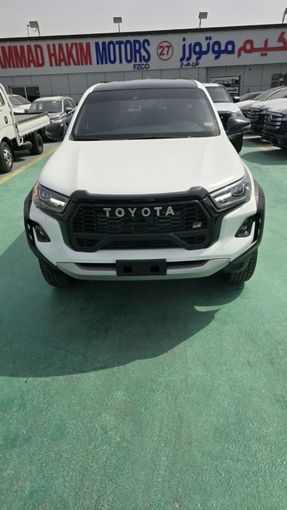 New Toyota Hilux VIII Facelift, 2.8 l, 2025 in Dubai by Mohamed Hakim Motors, White color. GCC Specs | AUTO.AE