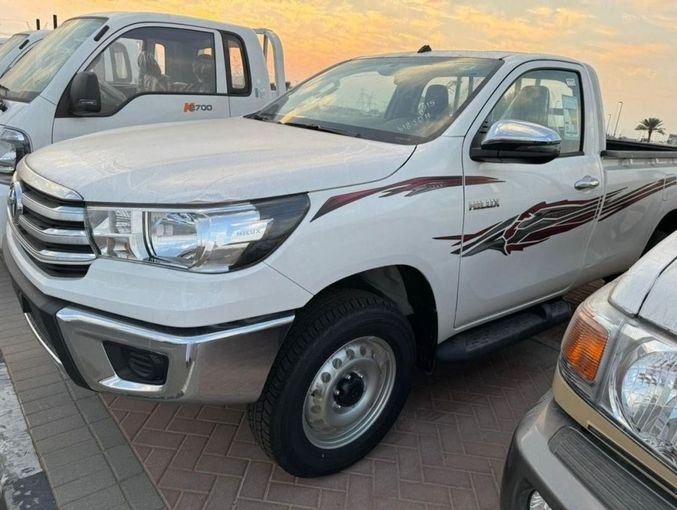 New Toyota Hilux VIII Facelift 2, 2.7 l, 2024 in Dubai by Mohamed Hakim Motors, White color. GCC Specs | AUTO.AE