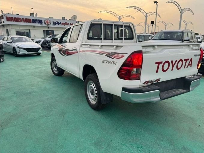 New Toyota Hilux VIII Facelift, 2.7 l, 2023 in Dubai by Mohamed Hakim Motors, White color. GCC Specs | AUTO.AE