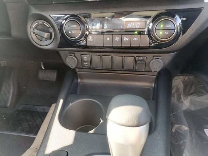 New Toyota Hilux VIII Facelift, 2.4 l, 2023 in Dubai by Mohamed Hakim Motors, White color. GCC Specs | AUTO.AE