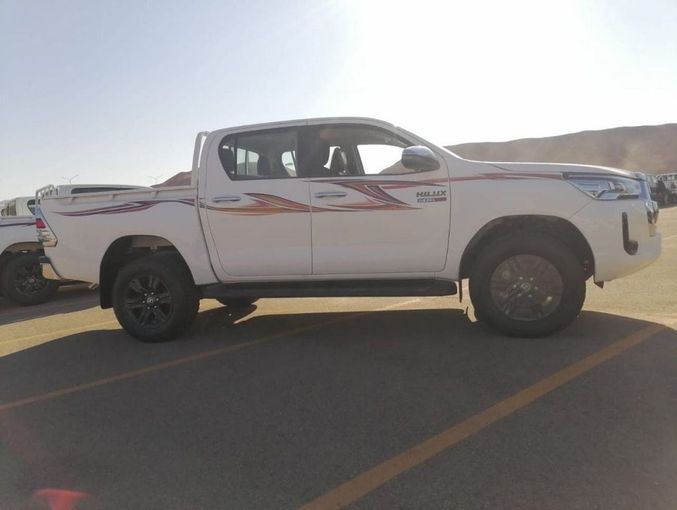 New Toyota Hilux VIII Facelift, 2.4 l, 2023 in Dubai by Mohamed Hakim Motors, White color. GCC Specs | AUTO.AE