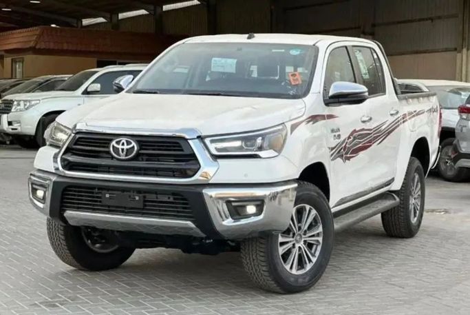 New Toyota Hilux VIII Facelift 2, 2.4 l, 2024 in Dubai by Mohamed Hakim Motors, White color. GCC Specs | AUTO.AE