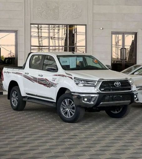 New Toyota Hilux VIII Facelift 2, 2.8 l, 2024 in Dubai by Mohamed Hakim Motors, White color. GCC Specs | AUTO.AE