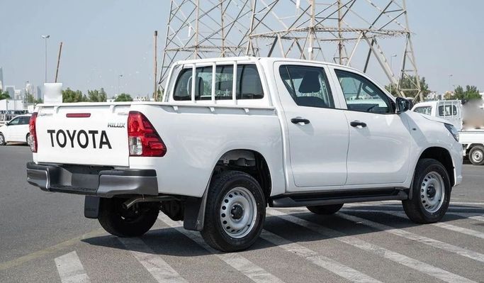 New Toyota Hilux Extra Cab VIII Facelift, 2.4 l, 2023 in Dubai by Mohamed Hakim Motors, White color. GCC Specs | AUTO.AE