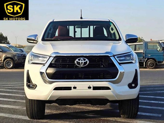 New Toyota Hilux VIII Facelift, 2.7 l, 2023 in Dubai by SK Motors, White color. GCC Specs | AUTO.AE