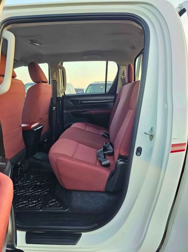 New Toyota Hilux VIII Facelift, 2.7 l, 2023 in Dubai by SK Motors, White color. GCC Specs | AUTO.AE