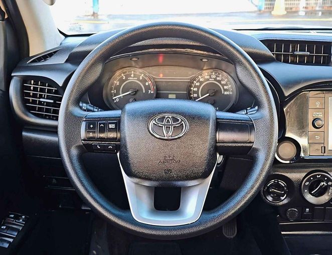 New Toyota Hilux VIII Facelift, 2.7 l, 2023 in Dubai by SK Motors, White color. GCC Specs | AUTO.AE