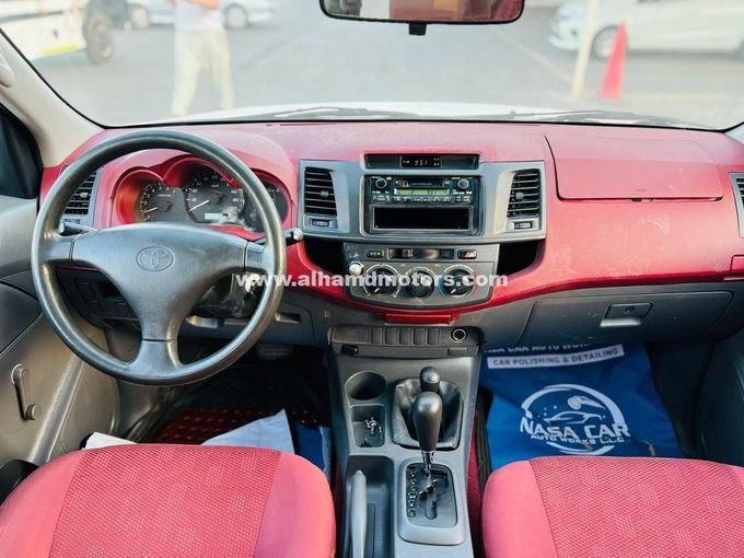 Подержанный Toyota Hilux VII Рестайлинг, 2.7 л, 2012 в Дубае от Alhamd Motors Белый цвет. GCC | AUTO.AE