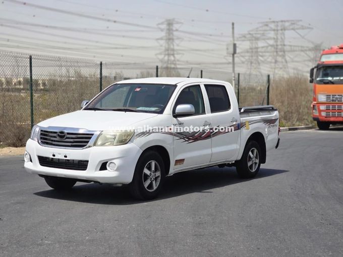 Подержанный Toyota Hilux VII Рестайлинг, 2.7 л, 2014 в Дубае от Alhamd Motors Белый цвет. GCC | AUTO.AE