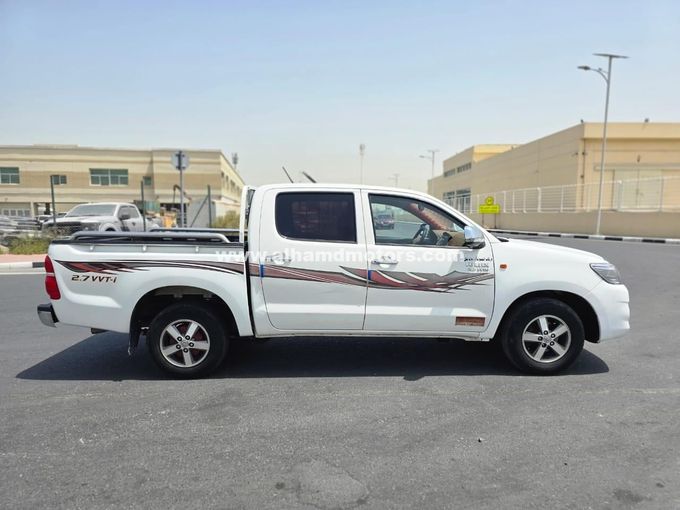 Подержанный Toyota Hilux VII Рестайлинг, 2.7 л, 2014 в Дубае от Alhamd Motors Белый цвет. GCC | AUTO.AE